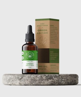 Premium CBD Brothers green edition CBD oil bottle and packaging on circular plinth