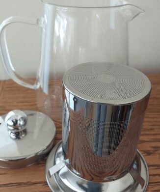 The CBD Flower Shop Teapot With Infuser on wooden table – 450ml