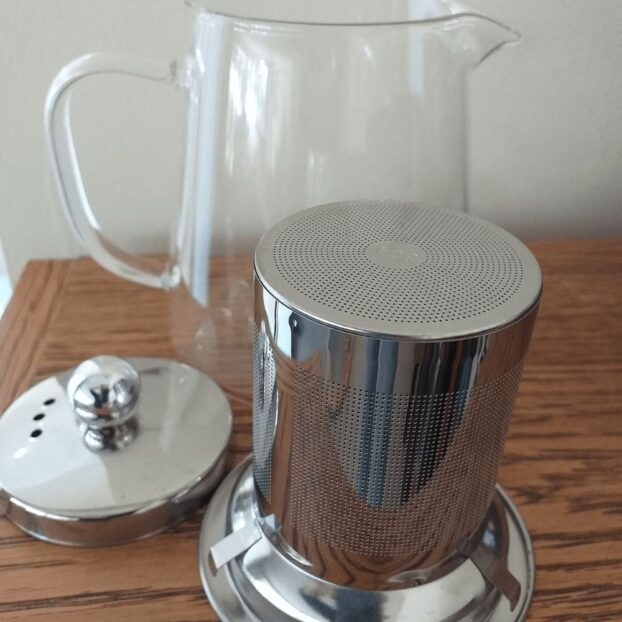 The CBD Flower Shop Teapot With Infuser on wooden table – 450ml
