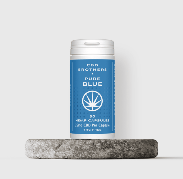 CBD Brothers pure blue CBD capsules on stone plinth