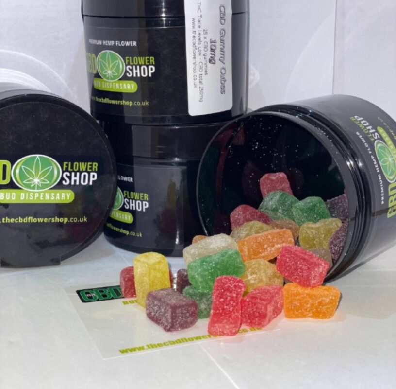 Fruity Cubes CBD Gummies spilling out of pot