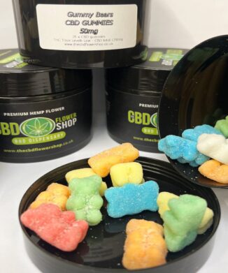 CBD Gummy Bears 50mg spilling out of open pot onto lid