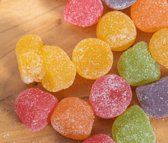 CBD gummies on wooden table