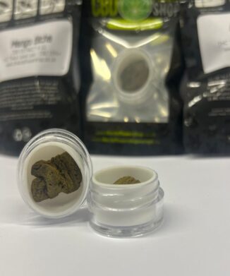 Mango Biche CBD Extract in small open pot on table