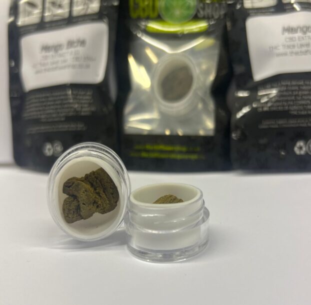 Mango Biche CBD Extract in small open pot on table