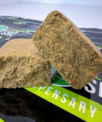 Soft Blonde CBD Extract broken in half on top of branded packaging