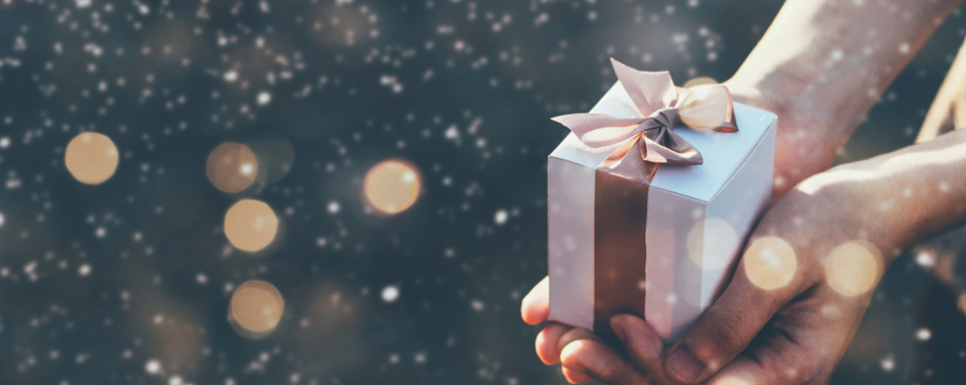CBD Flower In Gift Packaging Being Held By Woman