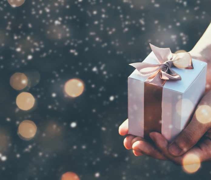 CBD Flower In Gift Packaging Being Held By Woman