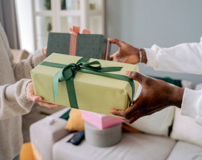 Man and woman exchanging gifts