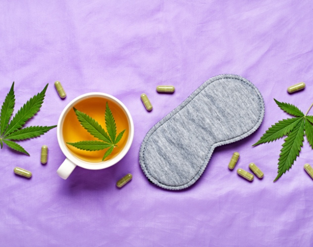 CBD tea, CBD capsules and a sleep mask on a purple background