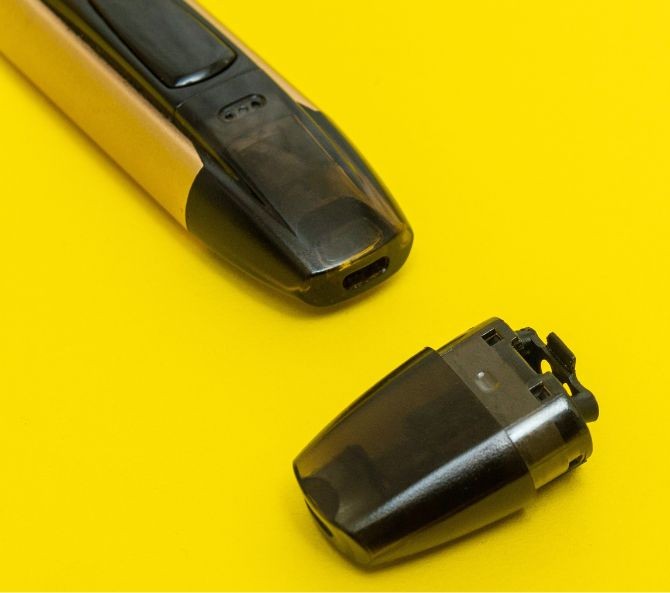 cbd vape pod system on yellow background