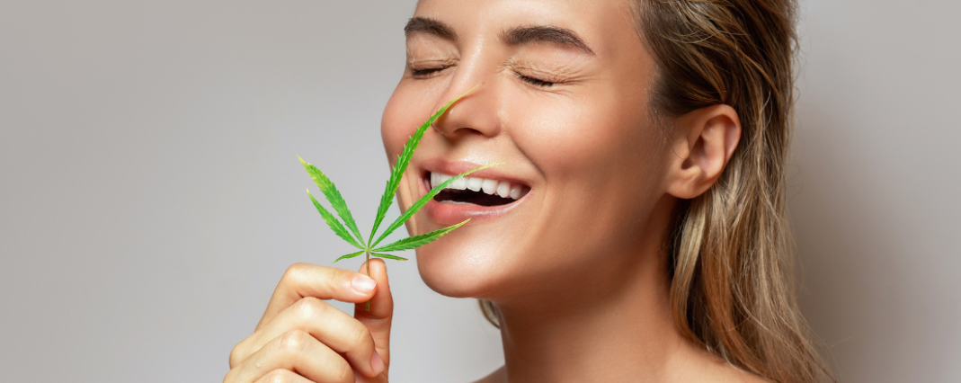 a woman holding a CBD flower