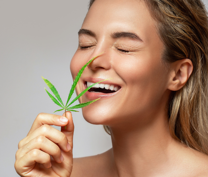 a woman holding a CBD flower