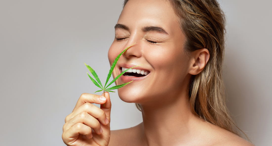 a woman holding a CBD flower