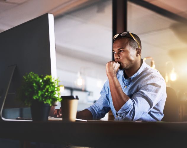 Man focusing at work desk