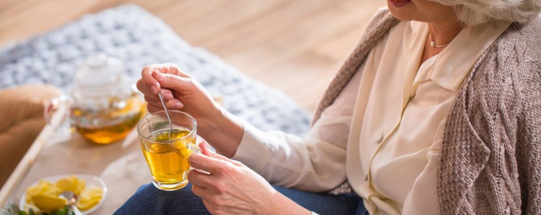 a woman enjoying cbd tea