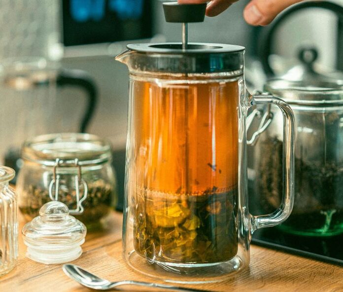 CBD tea brewing in cafetiere on kitchen counter