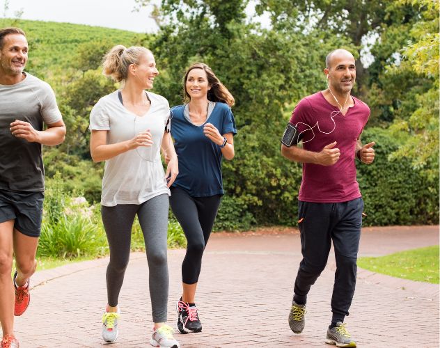 group of four people jogging