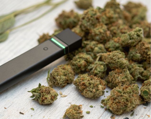 cbd vape on top of cbd flower buds