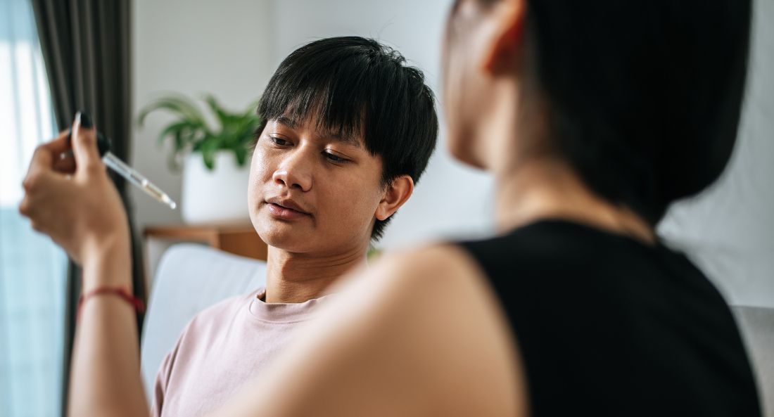 Woman giving man cbd oil