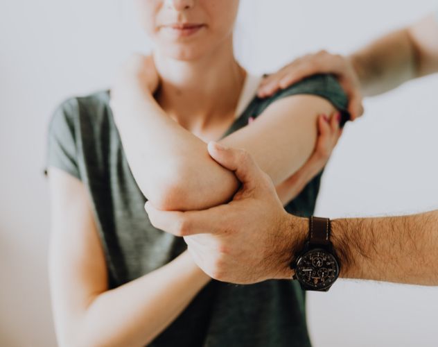 woman being assessed for joint pain