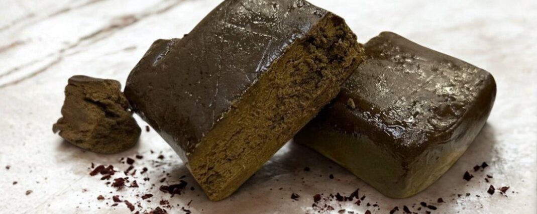 lebanese rouge cbd extract pieces on white marble surface