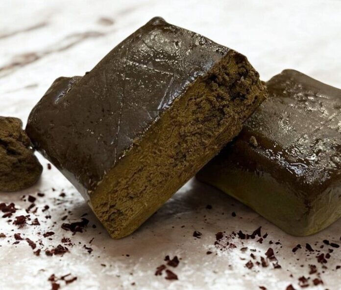 lebanese rouge cbd extract pieces on white marble surface