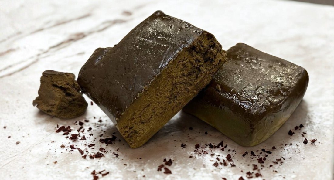 lebanese rouge cbd extract pieces on white marble surface