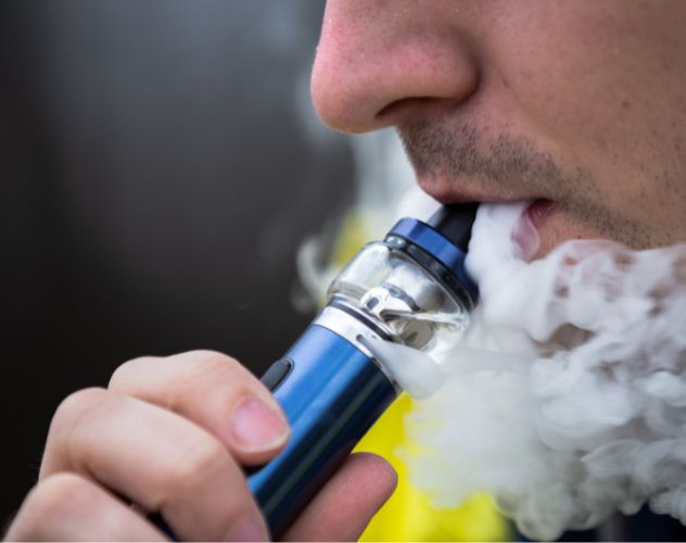 close up of man vaping