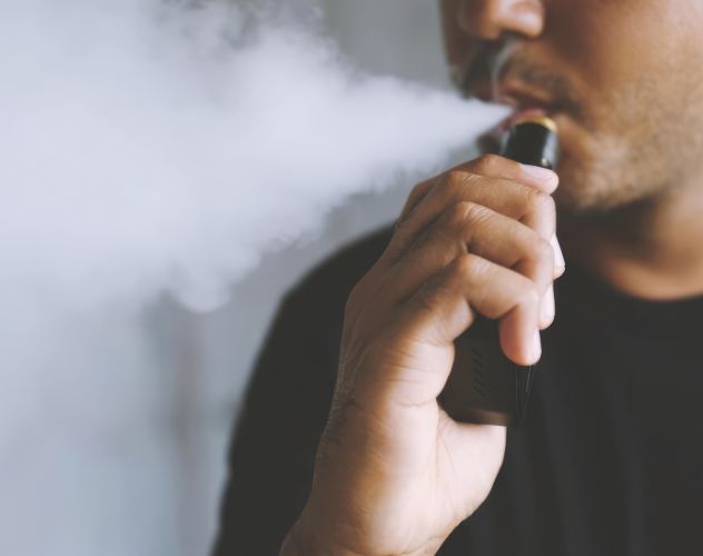close up of man vaping